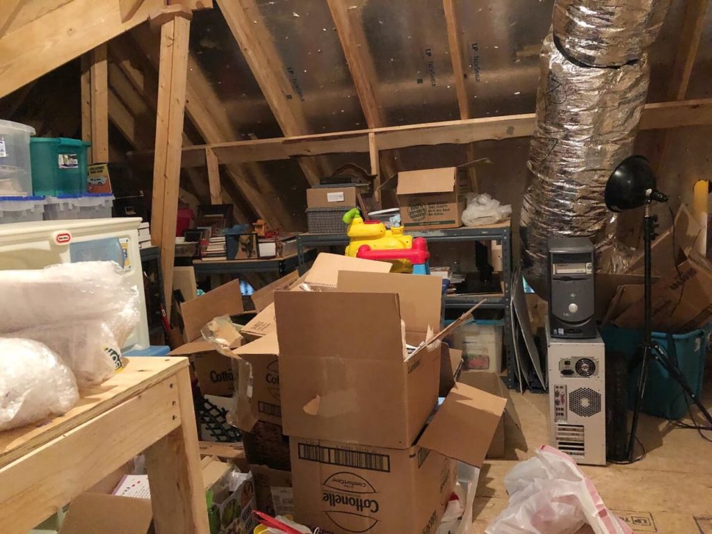cluttered loft prior to loft conversion